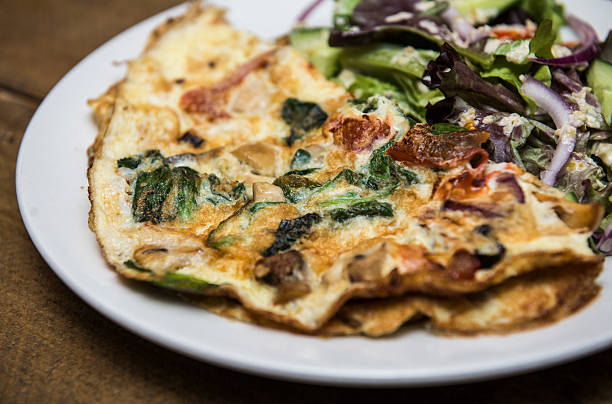 istock Omelette with mashrooms, bacon and vegetables 578099256