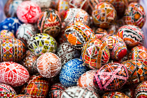 Close up image of collection of hand painted eggs. Each egg has its own unique design and has been individually hand painted. Horizontal colour image.