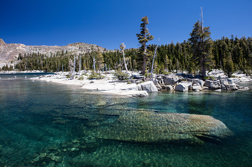 Lake Aloha, part of the Desolation Wilderness in eastern California, is a flooded glacial basin at an elevation of about 8200 feet. This gorgeous and federally protected wilderness area is in the Sierra Nevada mountains near Lake Tahoe.