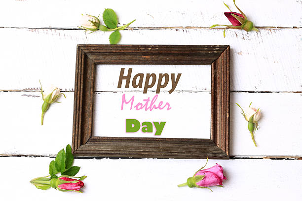 istock Frame rosebuds on a white wooden background 578100694
