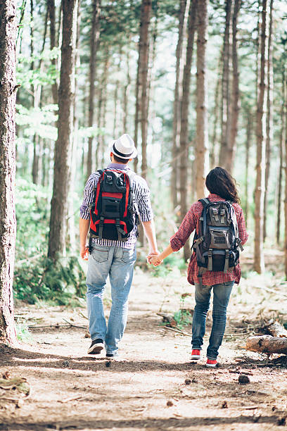 istock Young couple enjoying time together in the forest 578102924