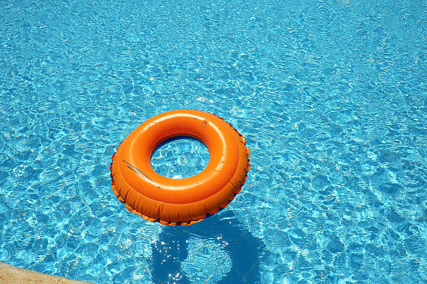 istock Inflatable Rubber Ring in a beautiful blue pool 578103932