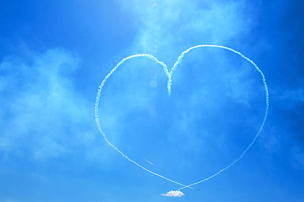 istock Airplanes making a heart in the sky 578104236