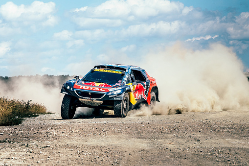 Filimonovo, Russia - July 11, 2016: racing car Peugeot driving on a dusty road during Silk way rally