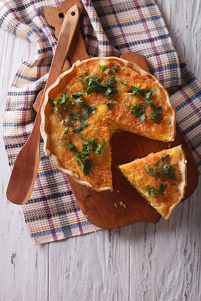 istock French quiche Lorraine on the table. vertical top view 578107606