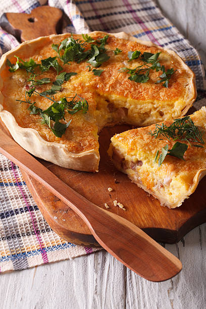 istock Homemade quiche Lorraine close-up on a cutting board. Vertical 578108660