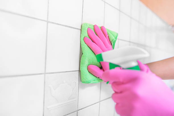istock Hands wash the tiles in the kitchen. 578111898