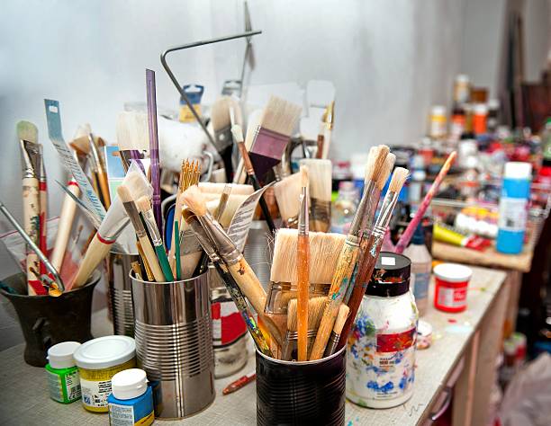 istock Brushes and paints in the artist's studio. 578112422