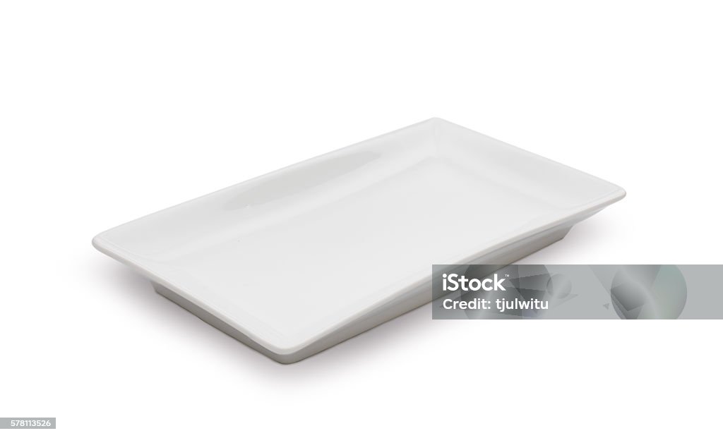 Empty white ceramic dish on white background Empty white ceramic dish on over white background, rectangle dish Plate Stock Photo