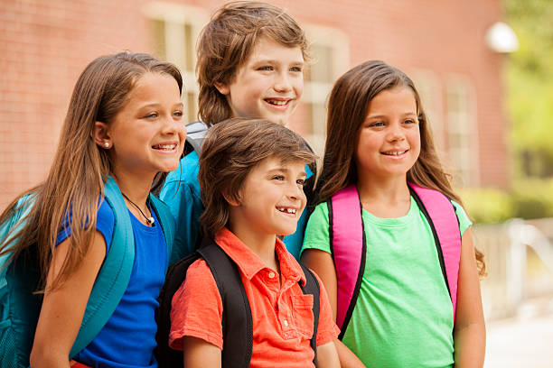 istock Back to School:  Elementary-age children, friends on school campus. 578113788
