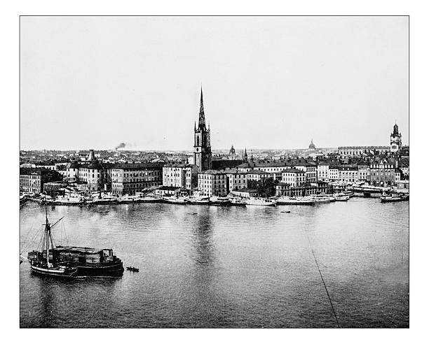 Antique photograph of Gamla Stan-Stockholm (Sweden) -19th century Antique photograph of panoramic view of the so-called Old town of the city of Stockholm (Sweden) in a late 19th century picture. The photograph depictes the island on which is located the most ancient part of the city (Gamla Stan) with some of its landmarks like the large German Church (Tyska kyrkan) and several mansions and palaces lake malaren photos stock illustrations
