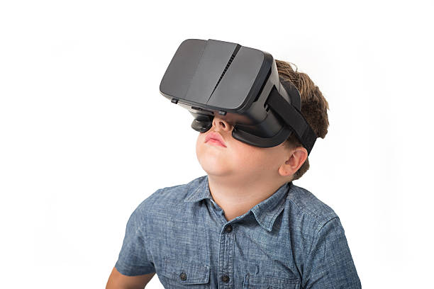 istock Boy in virtual reality glasses playing the game 578114212