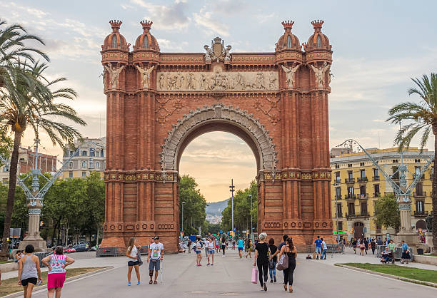 Arc de Triomf in Barcelona Barcelona, Spain - July 11, 2016: Arc de Triomf at the end of a promenade leading to the Parc de la Ciutadella in Barcelona. People are walking to Parc de la Ciutadella. parc de la ciutadella stock pictures, royalty-free photos & images