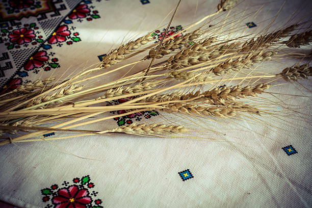 istock Ears of barley on a white tablecloth 578117852