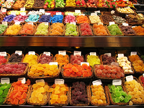 Colorful image of various sweets, candied fruit jelly at market stall