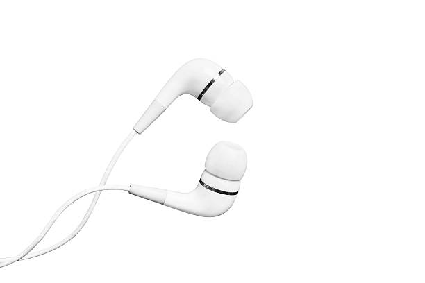 Earphones White wired earphones on white background headphones plugged in photos stock pictures, royalty-free photos & images