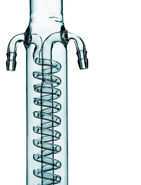 Glass spiral pipe of reflux condenser isolated on white
