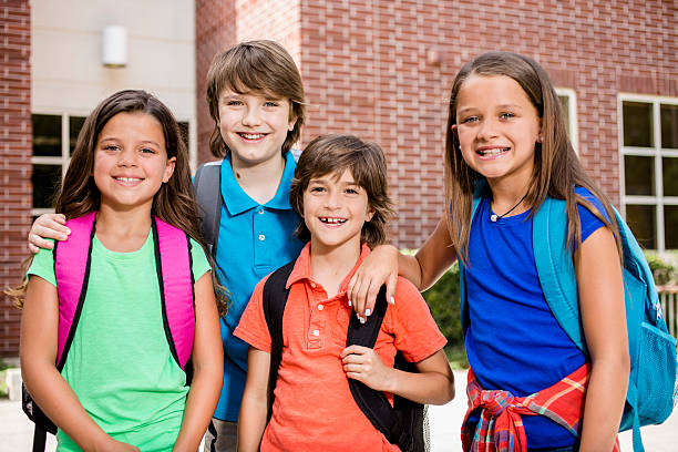 istock Back to School:  Elementary-age children, friends on school campus. 578120386