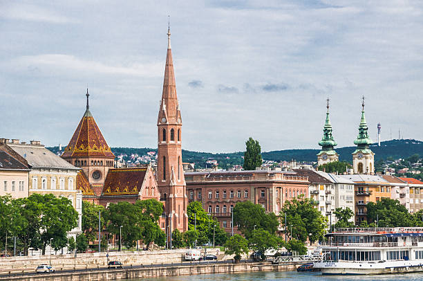 Budapest, Hungary- June 4, 2016: The dinner and excursion cruise ship Europa is docked on the Buda side of the Danube River at the base of the Buda Calvinist Church