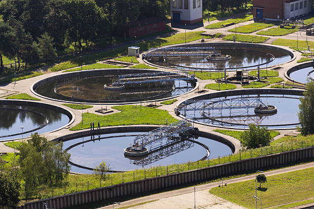 istock Men checking water storage tanks at sewage treatment plant 578122680