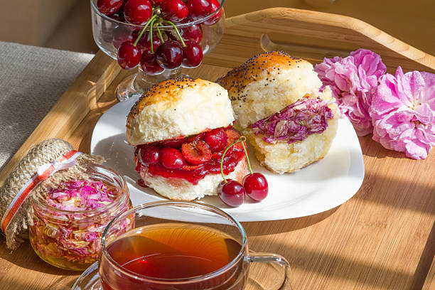 romantic tea with cherry scones - flower cherry cup tea imagens e fotografias de stock