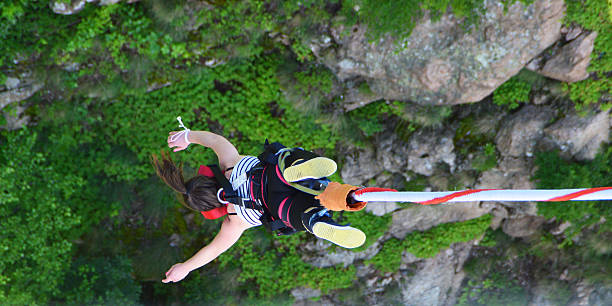 Bungee jumper girl falling down stock photo