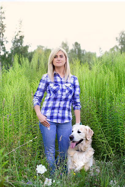 istock Girl walking with a dog 578265604