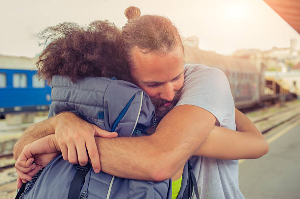istock Man meeting his girlfriend at the train station 578272066