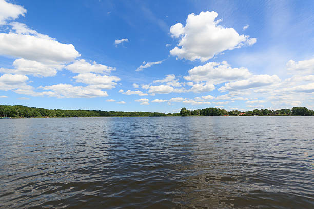 istock summer sky and clouds over lake landscape 578272510