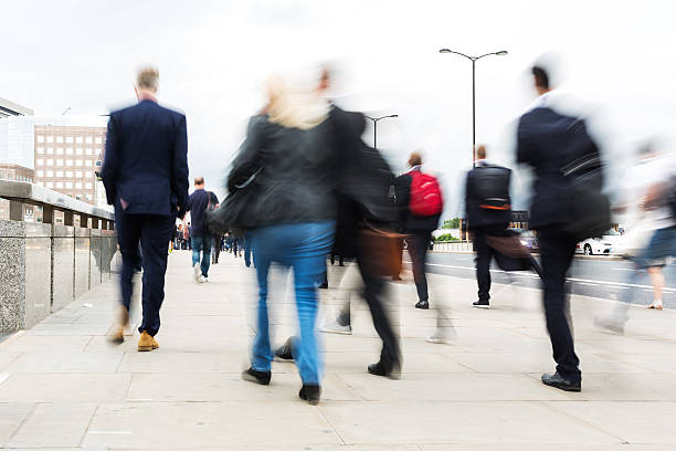 istock commuters walking in the city, in motion blur 578272700