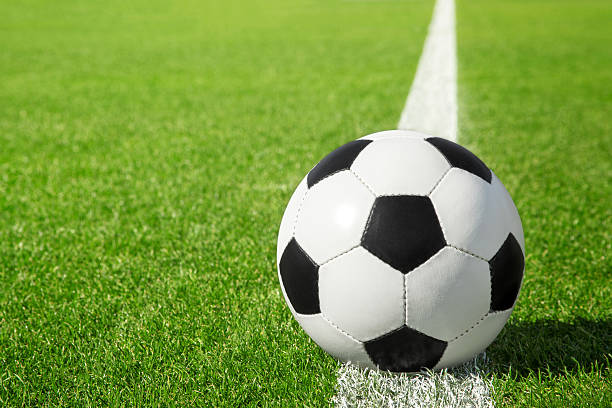 istock Soccer ball on green grass 578273356
