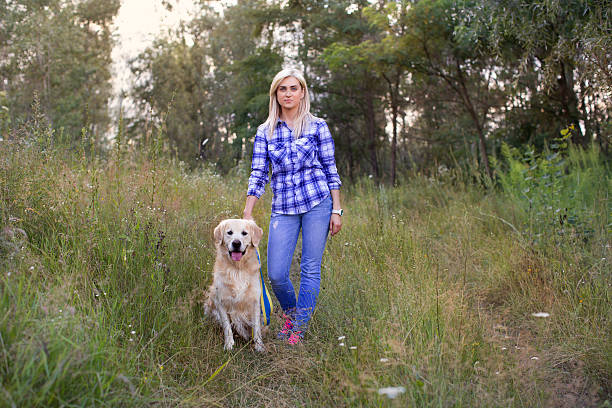 istock Girl walking with a dog 578275092