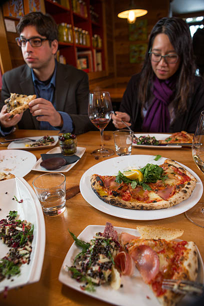 istock Group of ethnic friends dining at restaurant 578275236