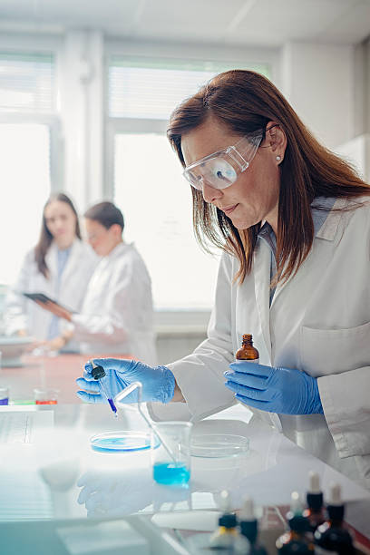 istock Focused scientist examining petri dishes 578275650