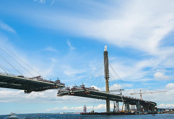 istock The construction of a cable-stayed road bridge across the river. 578275804