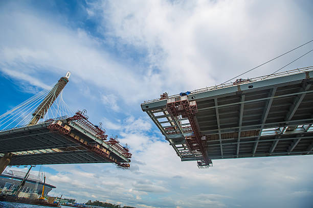 istock The completion of bridge across river. Cable. bottom vie 578275858