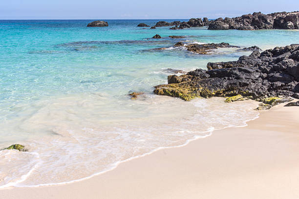 istock Black rock and turquoise water 578275932