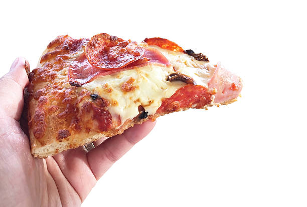 istock Woman hand holding slice pizza isolated on white background 578278156