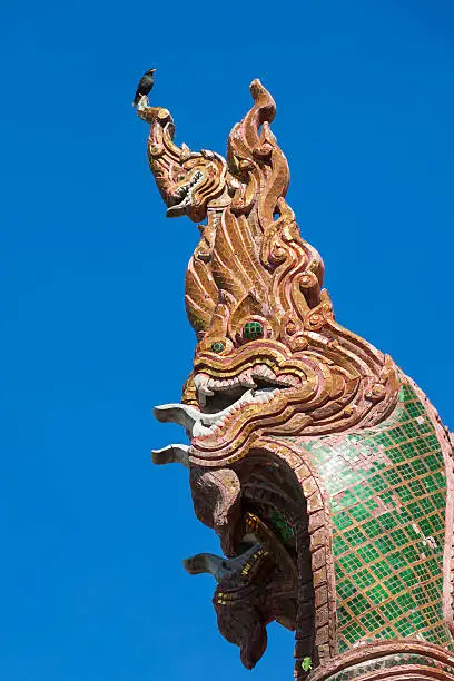 Naga sculpture on the roof of the temple
