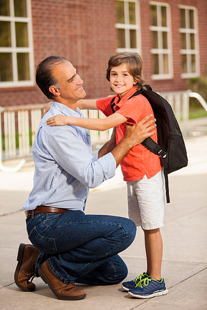 istock Dad reassures nervous boy on first day of school. 578280614