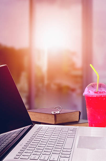 istock Home workplace with laptop on wood table against the windows. 578280692