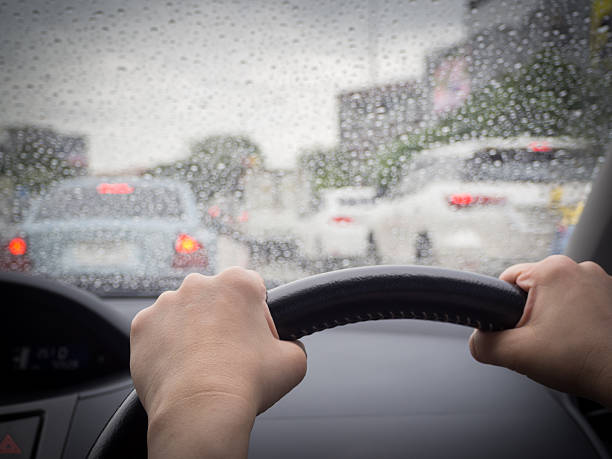 istock Drive in a rainy day, Rain drops on windshield car 578281628