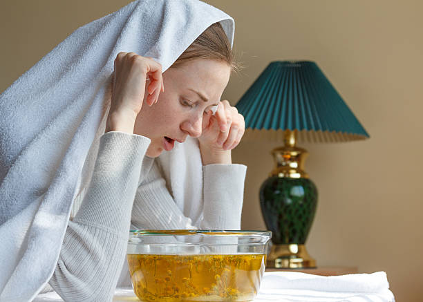 istock young woman breathes herbal decoction 578282934
