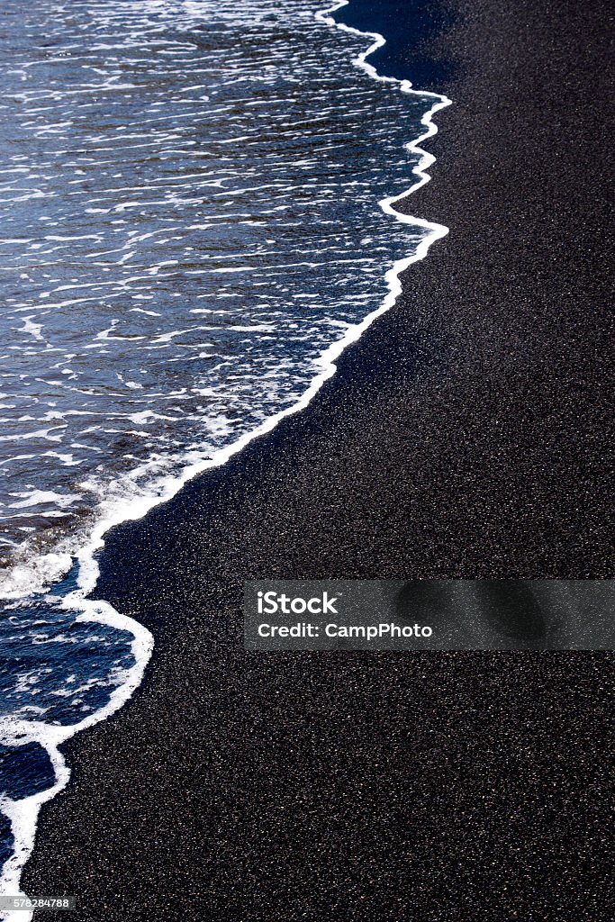 Punalu'u Beach Tide water on black sand. Big Island, Hawaii. Basalt Stock Photo