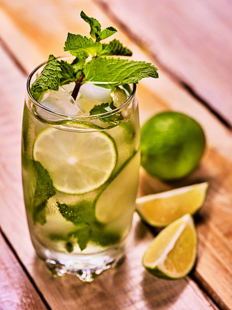 istock On wooden boards is glass with mohito and lime. 578294124