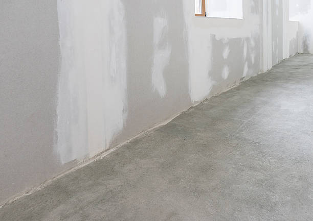 istock Unfinished apartment interior with concrete floor 578296418