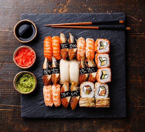 istock Sushi Set nigiri and rolls on slate board 578297046