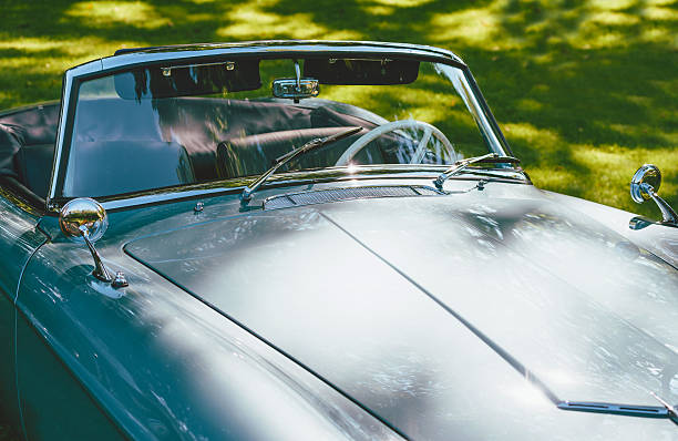 istock Oldtimer interior with steering wheel and rearview mirrors on hood 578297264