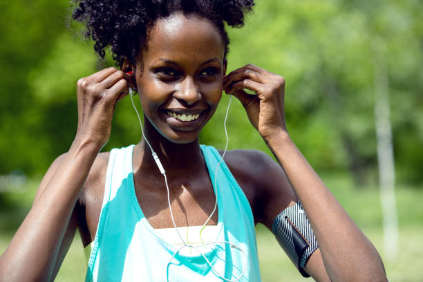 istock Confident woman listening music 578298382