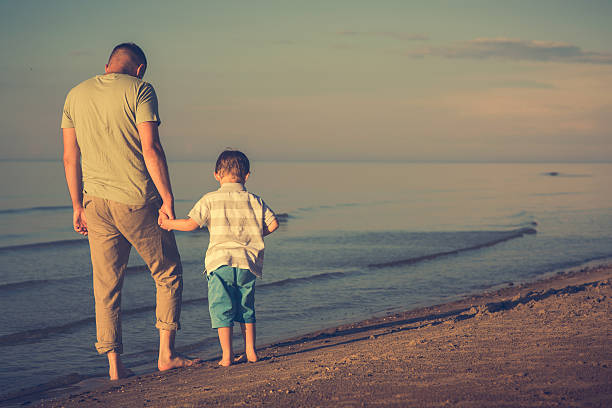 istock Father and son on the beach 578299998